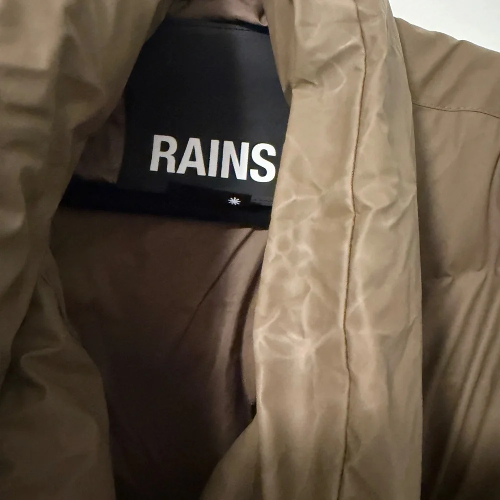 Rains Long Puffer Coat in Brown - Picture 16 of 16